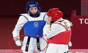 پرچم ایران روی کمربند کیمیا علیزاده/ عکس