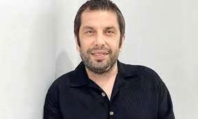  عباس جمشیدی‌فر در آغوش پدرش در ایام کودکی